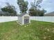 Backyard shed with a white fence creating a private backyard at 3128 Montague Ave, Spring Hill, FL 34608