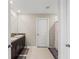 Bathroom with double sink vanity and tiled floor at 313 Argyll Dr, Spring Hill, FL 34609