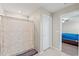 Bathroom features a neutral shower curtain and white tiled floors at 313 Argyll Dr, Spring Hill, FL 34609