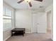 The bedroom boasts a ceiling fan, a window with blinds, and a closet with double doors at 313 Argyll Dr, Spring Hill, FL 34609