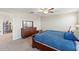 Cozy bedroom with dark wood furnishings and carpeted floor at 313 Argyll Dr, Spring Hill, FL 34609