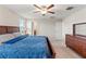 Bright bedroom with neutral walls, ceiling fan, and carpet at 313 Argyll Dr, Spring Hill, FL 34609