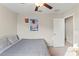 Bedroom with wall art, ceiling fan and closet door at 313 Argyll Dr, Spring Hill, FL 34609