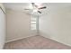 Bright and airy bedroom showcases a window with blinds and an overhead ceiling fan at 313 Argyll Dr, Spring Hill, FL 34609