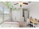 Charming bedroom is complete with blinds, hanging vines, and a closet with double doors at 313 Argyll Dr, Spring Hill, FL 34609