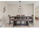 Modern dining room features a dark wood table with seating for six and unique wall decor at 313 Argyll Dr, Spring Hill, FL 34609