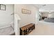 Hallway showcasing staircase and shoe storage, leading to a living area with decorative accents at 313 Argyll Dr, Spring Hill, FL 34609