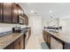 Bright kitchen with stainless steel appliances, granite countertops, and easy access to the dining area at 313 Argyll Dr, Spring Hill, FL 34609