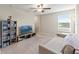 Spacious loft area with cozy seating, entertainment center, and natural lighting at 313 Argyll Dr, Spring Hill, FL 34609