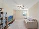 Upstairs loft with TV, ceiling fan and lots of shelf space at 313 Argyll Dr, Spring Hill, FL 34609