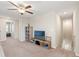 Upstairs loft featuring a ceiling fan and TV with scenic view, perfect for relaxation at 313 Argyll Dr, Spring Hill, FL 34609