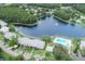 Overhead view of condos with access to a pool and beautiful lake with fountain at 3153 Lake Pine Way # A1, Tarpon Springs, FL 34688