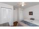 Cozy bedroom with a ceiling fan and closets for storage at 3153 Lake Pine Way # A1, Tarpon Springs, FL 34688