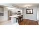 Bright kitchen featuring white cabinetry, stainless appliances, and breakfast bar seating at 3153 Lake Pine Way # A1, Tarpon Springs, FL 34688