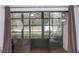 Enclosed sunroom with sliding glass doors, tiled floor and glass windows with lots of light at 3153 Lake Pine Way # A1, Tarpon Springs, FL 34688