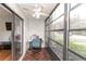 The glass enclosed lanai features tile flooring, a ceiling fan and lots of natural light at 3153 Lake Pine Way # A1, Tarpon Springs, FL 34688