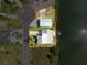 Aerial shot showing the lot outlined in red with waterfront access and a boat storage area at 3342 Turks Cap Dr, Hernando Beach, FL 34607