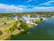 Waterfront home with boat dock and neighborhood setting with mature landscaping; beautiful water views at 3342 Turks Cap Dr, Hernando Beach, FL 34607