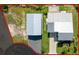 Aerial view showcasing the roof and expansive lot of a waterfront property, outlined in a red border at 3342 Turks Cap Dr, Hernando Beach, FL 34607