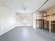 Spacious basement with newly painted gray floors, and built in shelves and storage space at 3342 Turks Cap Dr, Hernando Beach, FL 34607