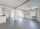 Expansive basement featuring gray painted floors, white walls, and great natural light at 3342 Turks Cap Dr, Hernando Beach, FL 34607