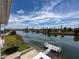 Scenic view from the rear of the home highlighting the private boat dock and waterfront location at 3342 Turks Cap Dr, Hernando Beach, FL 34607