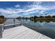 A canal-front dock offers a peaceful waterfront setting with clear water and neighborhood views at 3342 Turks Cap Dr, Hernando Beach, FL 34607