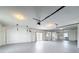 Spacious garage featuring lots of open space, utility hookups and an entrance to the house at 3342 Turks Cap Dr, Hernando Beach, FL 34607