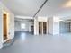 Large garage with light gray painted floors, attached closet space, and garage door at 3342 Turks Cap Dr, Hernando Beach, FL 34607
