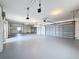 Spacious garage featuring lots of open space, utility hookups and a large garage door at 3342 Turks Cap Dr, Hernando Beach, FL 34607