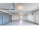 Clean and spacious garage with an overhead door and light gray painted floors at 3342 Turks Cap Dr, Hernando Beach, FL 34607