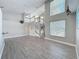 Bright and airy living space with high ceilings, wood laminate flooring, and a staircase at 3342 Turks Cap Dr, Hernando Beach, FL 34607