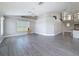 Spacious living room featuring light gray flooring and open floor plan at 3342 Turks Cap Dr, Hernando Beach, FL 34607
