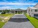 Covered parking area beside a two-story home with views of the waterfront at 3342 Turks Cap Dr, Hernando Beach, FL 34607