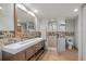 Modern bathroom featuring a double vanity, tiled walk-in shower, and updated fixtures at 34955 Blanton Rd, Dade City, FL 33523