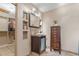 Modern bathroom with custom cabinet and vessel sink and a large walk-in closet at 34955 Blanton Rd, Dade City, FL 33523