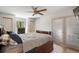 Comfortable bedroom features wood flooring and doors leading to the outside at 34955 Blanton Rd, Dade City, FL 33523