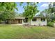 Charming single-story home featuring stone accents and a well-maintained front yard at 34955 Blanton Rd, Dade City, FL 33523