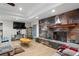 Cozy living room showcasing a modern fireplace, large TV, and comfortable seating at 34955 Blanton Rd, Dade City, FL 33523