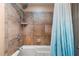 Shower and bath tub with custom tile work with a shower head and faucet at 34955 Blanton Rd, Dade City, FL 33523