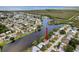 Aerial view of the property highlighted in a neighborhood on the water at 3545 Landale Dr, Holiday, FL 34691