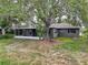 Charming home with a private backyard and large tree providing plenty of shade at 3545 Landale Dr, Holiday, FL 34691