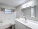 Bathroom with white tiled shower and new vanity with undermount sink at 3545 Landale Dr, Holiday, FL 34691