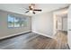 Bright bedroom shows natural light from the window overlooking the lake, and neutral walls at 3545 Landale Dr, Holiday, FL 34691