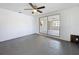 Spacious bonus room with painted block walls, ceiling fan, and access to living room at 3545 Landale Dr, Holiday, FL 34691