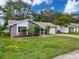 Charming single-story home with well-maintained landscaping and attached one car garage at 3545 Landale Dr, Holiday, FL 34691