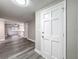 Inviting foyer with modern gray wood flooring leads into an open-concept living space at 3545 Landale Dr, Holiday, FL 34691