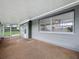 This covered lanai offers protection from the elements while enjoying the outdoors at 3545 Landale Dr, Holiday, FL 34691