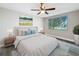 Cozy main bedroom with a large window overlooking a serene landscape, complete with stylish decor at 3545 Landale Dr, Holiday, FL 34691