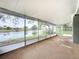 Spacious screened patio with water views and a white ceiling at 3545 Landale Dr, Holiday, FL 34691